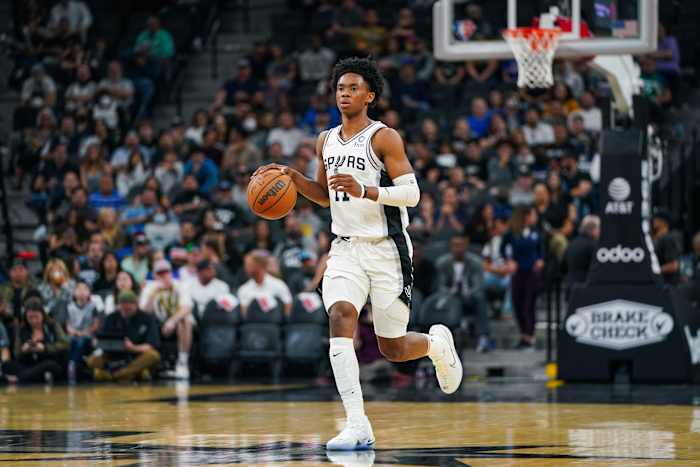 San Antonio Spurs guard Josh Primo (11) dribbles the ball.